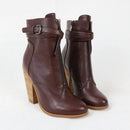 Brown ankle boots with wooden heel on a white background, branded 'Obroi'.