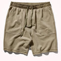 Beige shorts with an elastic waistband on a white background, Obroi