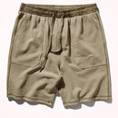Beige shorts with an elastic waistband on a white background, Obroi