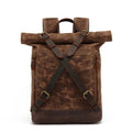 Brown leather backpack with rolled top on a white background, Obroi