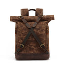 Brown leather backpack with rolled top on a white background, Obroi