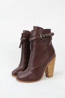 Pair of brown ankle boots with wooden heel on a white background, Obroi