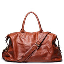 Brown leather bag with a shoulder strap on a white background, Obroi