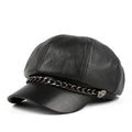 Black leather cap with chain detail on a white background, Obroi