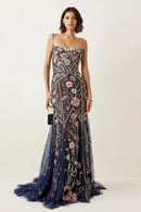 Woman wearing a floral evening gown on a white background, Obroi