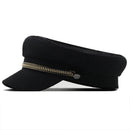 Black cap with gold chain on a white background, Obroi