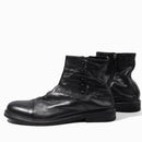 Pair of black leather boots on a white background, Obroi