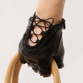 Black lace-up glove on a white background, Obroi