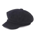 Black corduroy cap on a white background, Obroi