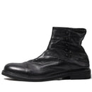 Black leather boot with buttons on a white background, Obroi