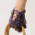 Purple ballet shoe with lace details on a white background, Obroi