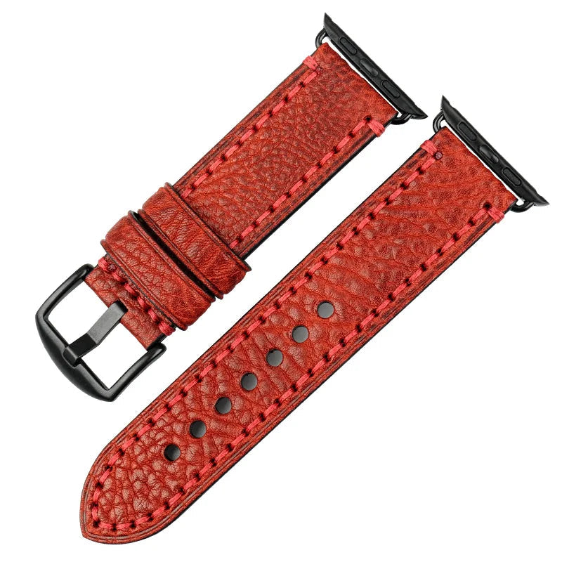 Red leather watch strap with black buckle on a white background