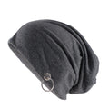 A dark gray slouchy knit beanie hat featuring a silver-tone metal O-ring hanging from the side, shown against a plain white background, Obroi
