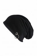 A black slouchy knit beanie hat with a silver-tone metal O-ring detail on the side, shown against a plain white background with the brand name 'Obroi' in the top left corner, Obroi
