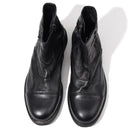 Pair of black leather boots on a white background, Obroi