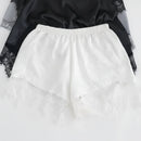 White lace pants with a black top on a white background, Obroi