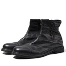 Pair of black leather boots with button details on a white background, Obroi