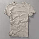 Beige t-shirt on a gray background, Obroi