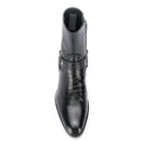 A single black leather ankle boot with a pointed toe, crocodile-embossed texture, and a side zipper, shown from a top-down view on a white background, Obroi