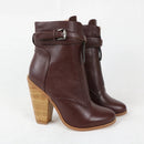 Brown leather ankle boots with wooden heel on a white background, featuring the brand 'Obroi'.