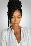 Black curly cornrow hair extension bundle held up by a hand, shown next to a woman wearing the hair in a high updo. The image has a pink and purple 'Obroi' logo overlay in the top left corner, Obroi