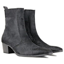Pair of black suede ankle boots on a white background, Obroi