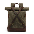 Green waxed canvas backpack with brown leather straps on a white background, Obroi