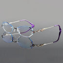 Pair of decorative eyeglasses with intricate design on a gray background, featuring the brand 'Obroi'.