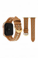 Brown leather watch strap with gold accents on a white background, Obroi