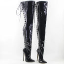 Black patent leather knee-high boots with chain details on a white background, featuring the Obroi brand.