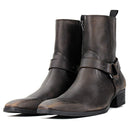 Pair of brown leather boots with buckles on a white background, Obroi