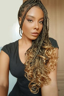 Box braids hair extensions shown on a model with long curly ombre braids, alongside a clean product shot of the black-to-blonde wavy box braids on a white background, Obroi