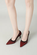 Black and red striped high-heeled shoes on a neutral background, Obroi
