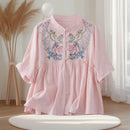 Pink dress with floral embroidery on a mannequin against a neutral background, Obroi