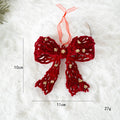 Red decorative bow with gold accents on a white background, showing measurements and weight, Obroi