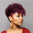 Woman with vibrant purple hair wearing gold earrings against a gray background, Obroi