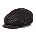 Black patterned cap with leather brim on a white background, Obroi