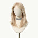 Blonde wig on a mannequin head with a white background, Obroi