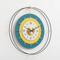 Decorative wall clock with a blue and yellow design on a white background, Obroi