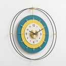 Decorative wall clock with a blue and yellow design on a white background, Obroi