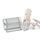 Silver clutch bag and high-heeled shoes on a white background, Obroi