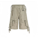 Beige cargo shorts with multiple pockets and straps on a white background, Obroi