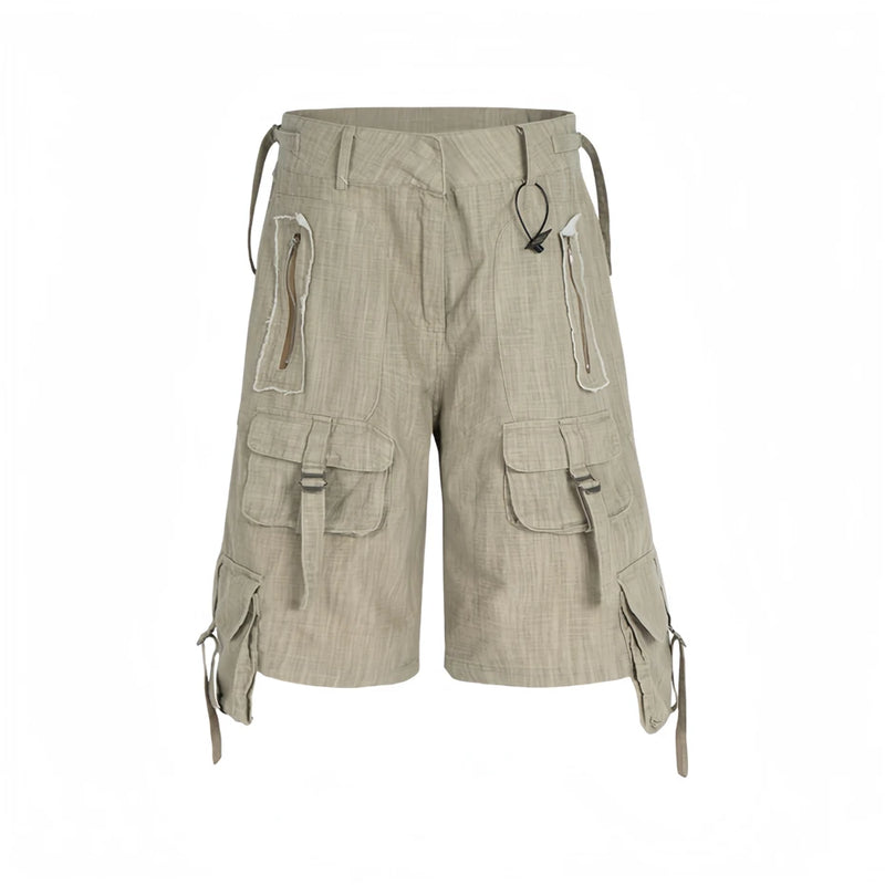 Beige cargo shorts with multiple pockets and straps on a white background, Obroi
