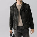 Person wearing a dark suede jacket with a gray background, Obroi