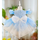 Light blue and white dress on a mannequin with a blurred background, Obroi