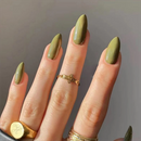 Hand with olive green nails and gold rings on a neutral background, Obroi