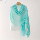 Turquoise scarf draped over a white shirt on a hanger against a white background, Obroi