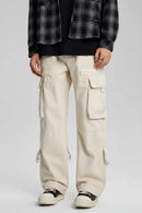 Person wearing beige cargo pants with a plain background, Obroi