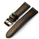 Brown leather watch strap with gold buckle on a white background, Obroi