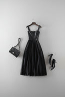 Black dress, handbag, and high heels on a white background, Obroi